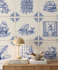 Azulejo wallpaper close-up with blue and white tiles showing a reader in an armchair, a library ladder, a sleeping cat, a tall ship and a whale