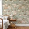 Fairy tale wallpaper with castles and a sleeping dragon in a kids bedroom with a wooden spindle bed