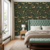 Green millefleur wallpaper behind a sage tufted headboard in a bedroom