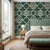 Mughal garden wallpaper in emerald behind a sage tufted headboard in a bedroom