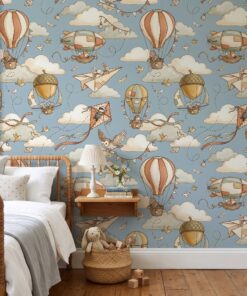 Hot air balloon wallpaper with animal aviators in a kids bedroom with a wooden spindle bed
