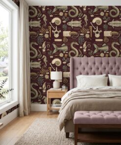 Maroon mythical sea creature wallpaper behind a mauve tufted headboard in a bedroom