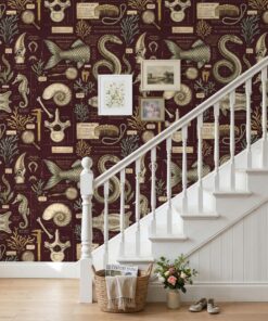 Maroon dark academia sea creature wallpaper on a staircase wall with a white banister