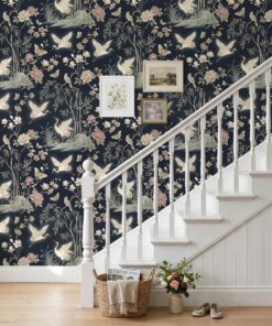 Navy chinoiserie crane garden wallpaper on a staircase wall with a white banister
