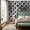 Navy Mughal wallpaper behind a sage tufted headboard in a bedroom