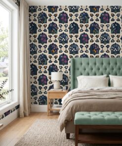 Navy Mughal wallpaper behind a sage tufted headboard in a bedroom
