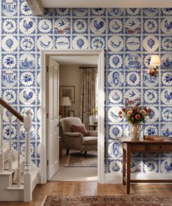 Classic azulejo Portuguese tile wallpaper in a hallway beside a white staircase and open doorway