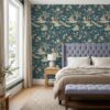Chinoiserie monkey wallpaper in teal behind a lilac tufted headboard in a bedroom