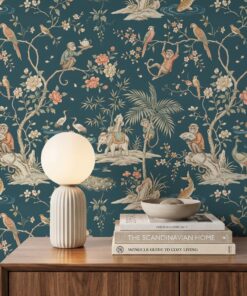 Close-up of teal chinoiserie wallpaper with monkeys serving tea, a white elephant, cranes, peacocks and coral peonies