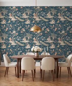 Teal chinoiserie monkey wallpaper in a powder room with a marble sink and brass fixtures