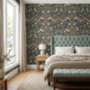 William morris style wallpaper in navy behind a sage tufted headboard in a bedroom