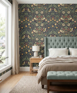 William morris style wallpaper in navy behind a sage tufted headboard in a bedroom