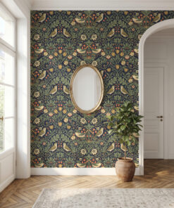 William Morris style bird wallpaper in an entryway with a gold oval mirror and arched doorway