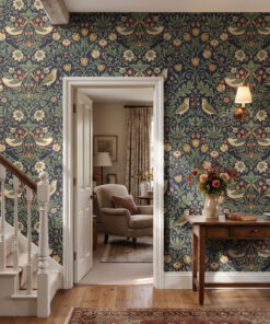 William Morris style strawberry and bird wallpaper in a hallway beside a white staircase