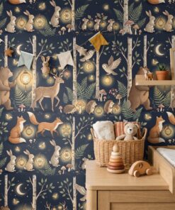 Lantern forest woodland wallpaper in a nursery with bunting, a shelf and a toy basket